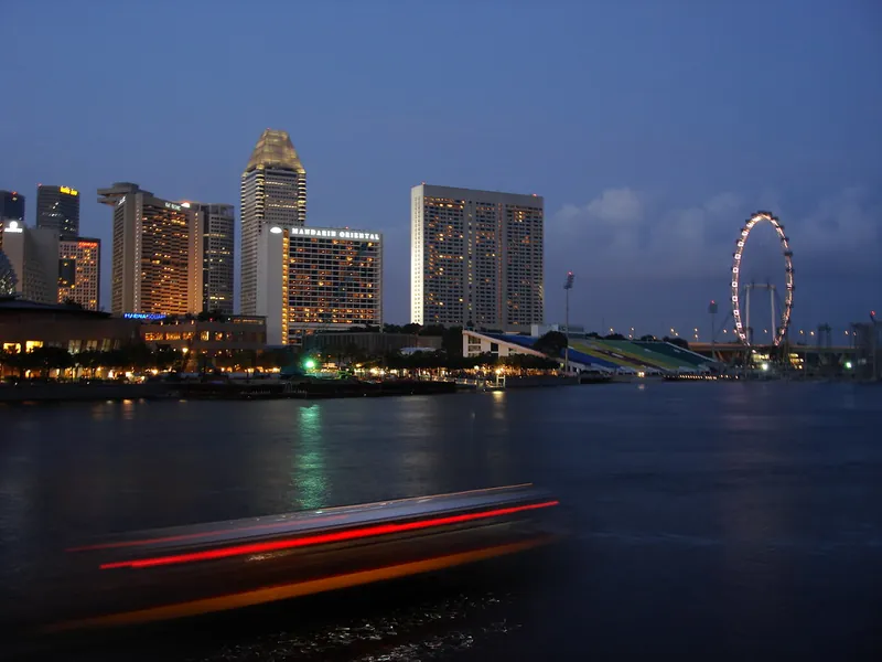 Singapore’s Marina Bay skyline and the Singapore Flyer at dusk